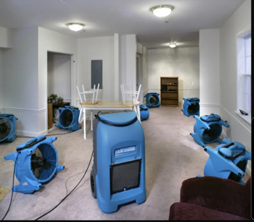 Air movers and dehumidifier setup for Water Damage Restoration in Southport